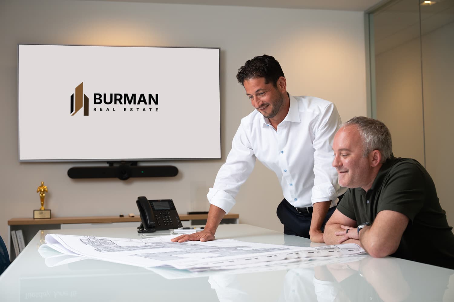 Scott Burman and Adam Mann reviewing plans